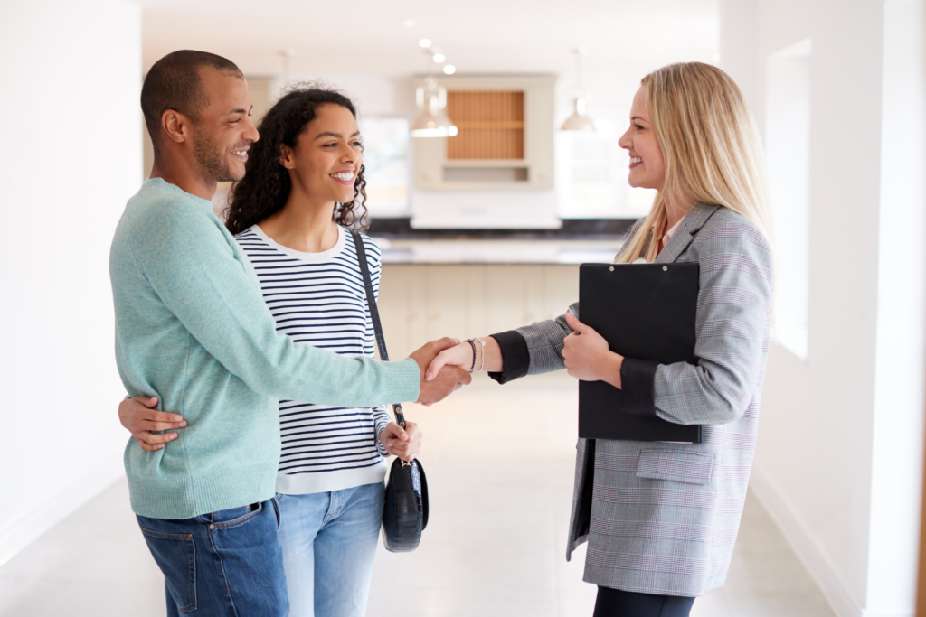 Realtor shaking hands with client